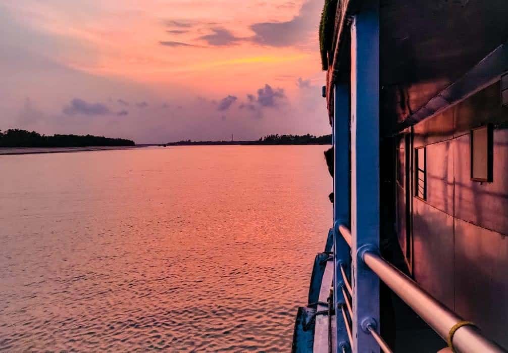 Sunset over the Sundarban river viewed from aboard Whispering Winds