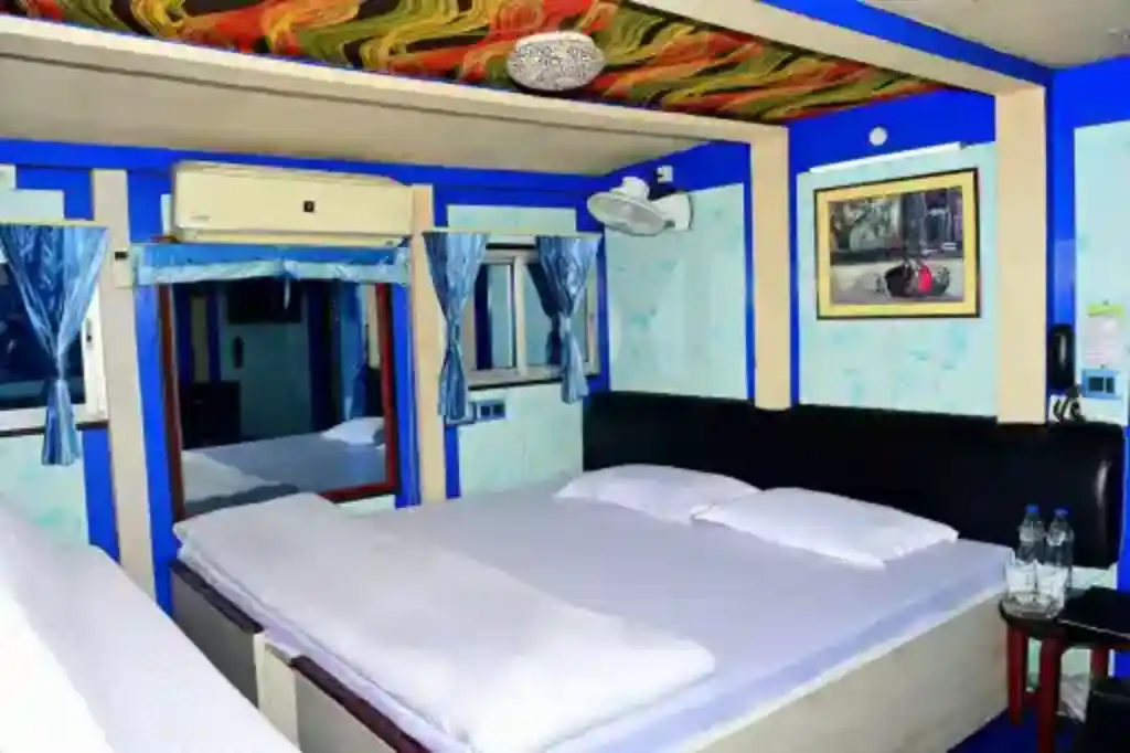 Super deluxe room of Sundarban Houseboat which can accommodate 6 guests who come for Sundarban Houseboat tour, in beds and bunk beds which can be modified as per guest requirement